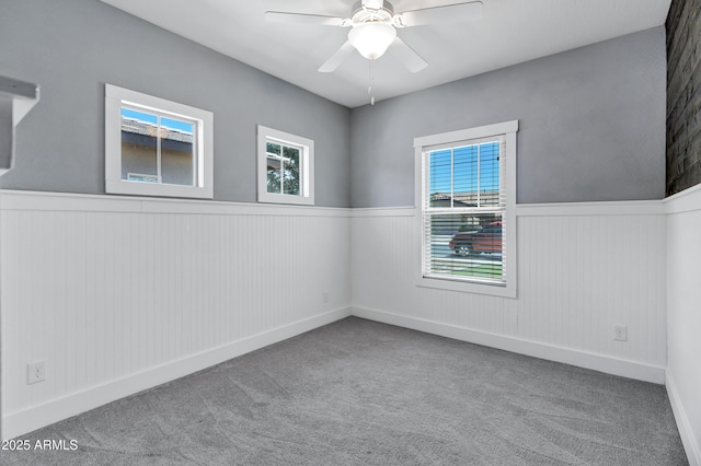 1272 W Joshua Tree Ave, Queen Creek, AZ 85140 - spare room with wainscoting, carpet, ceiling fan, and baseboards