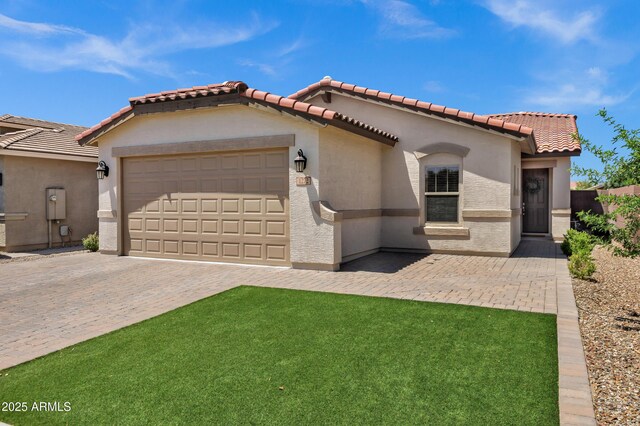 1272 W Joshua Tree Ave, Queen Creek, AZ 85140 - mediterranean / spanish home featuring stucco siding, a garage, driveway, and a tiled roof