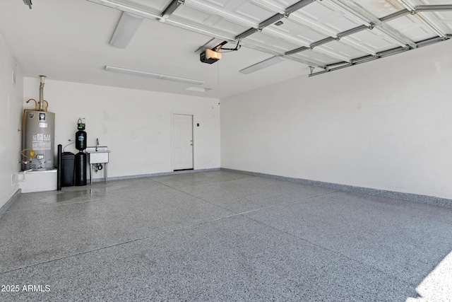 1272 W Joshua Tree Ave, Queen Creek, AZ 85140 - garage featuring gas water heater, baseboards, and a garage door opener