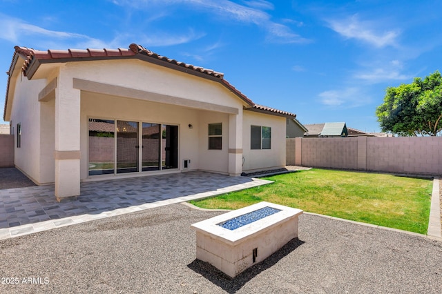 1272 W Joshua Tree Ave, Queen Creek, AZ 85140 - back of property featuring a patio area, a fire pit, stucco siding, and a tile roof