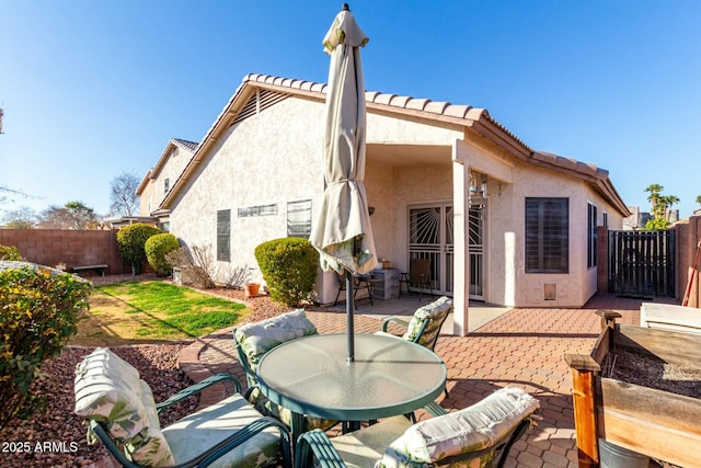 rear view of house featuring a patio area