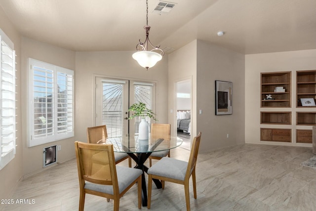 dining room with built in shelves