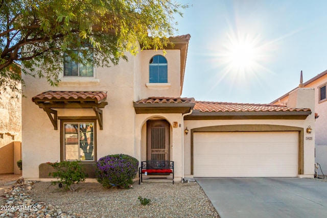 mediterranean / spanish house featuring a garage