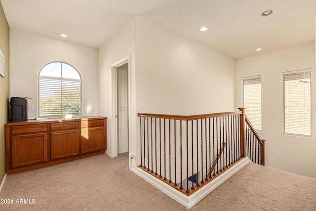 hallway with light carpet