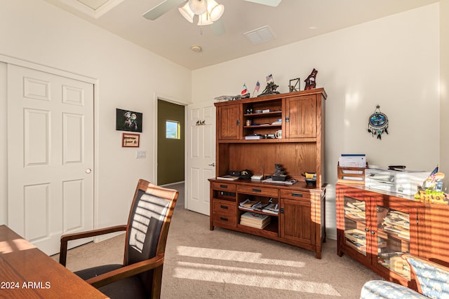 carpeted office space with ceiling fan