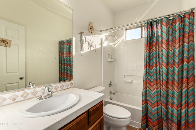 full bathroom with vanity, toilet, and shower / bath combo with shower curtain