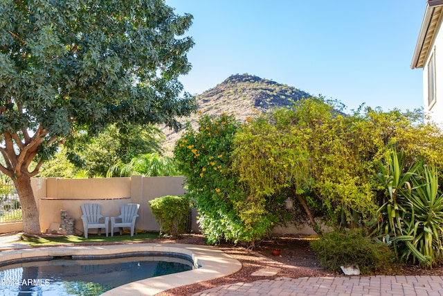 view of swimming pool featuring a mountain view