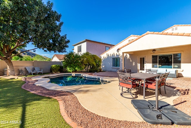 view of pool featuring ceiling fan, a lawn, and a patio area