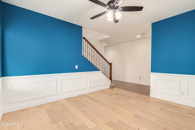 spare room featuring light hardwood / wood-style floors and ceiling fan