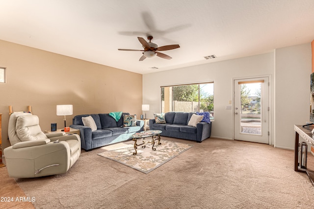 living room with carpet flooring and ceiling fan