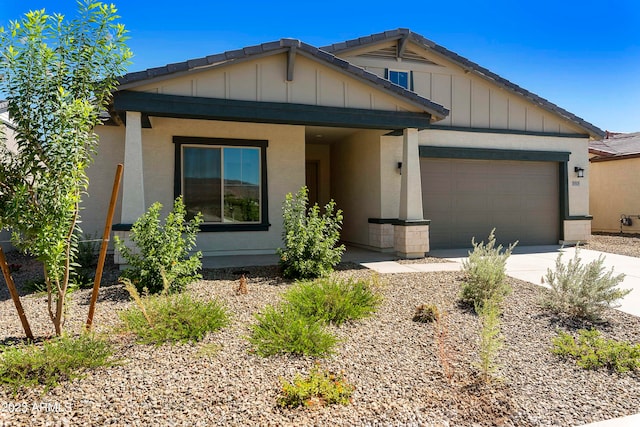 craftsman house featuring covered porch and a garage