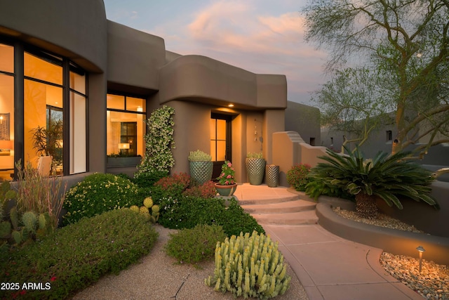 10040 E Happy Valley Rd Unit 1011, Scottsdale, AZ 85255 - view of exterior entry at dusk
