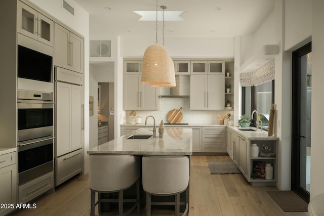 10040 E Happy Valley Rd Unit 1011, Scottsdale, AZ 85255 - kitchen with open shelves, a sink, and double oven
