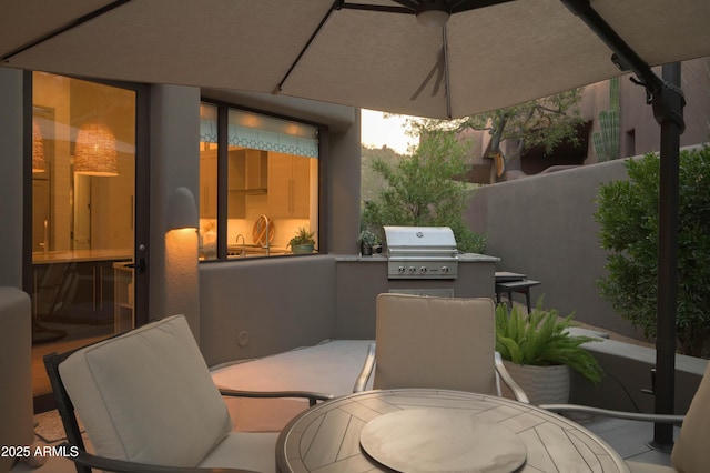 10040 E Happy Valley Rd Unit 1011, Scottsdale, AZ 85255 - view of patio / terrace featuring outdoor dining space, exterior kitchen, area for grilling, and fence