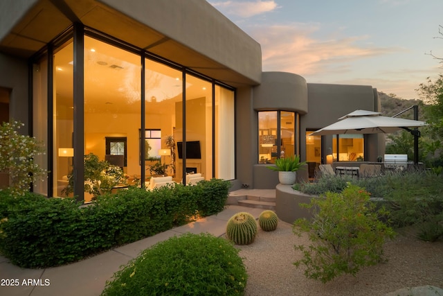 10040 E Happy Valley Rd Unit 1011, Scottsdale, AZ 85255 - view of exterior entry featuring stucco siding