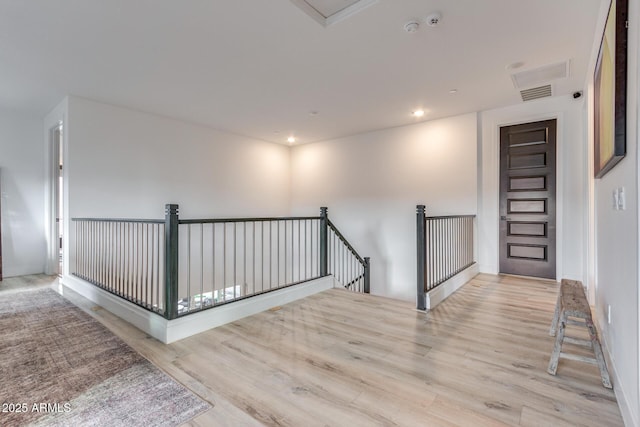 spare room featuring light wood-type flooring and recessed lighting