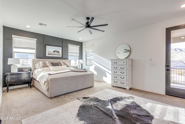 bedroom with access to outside, visible vents, and multiple windows