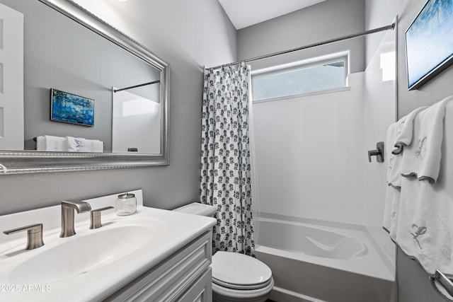 full bathroom featuring toilet, vanity, and shower / tub combo with curtain