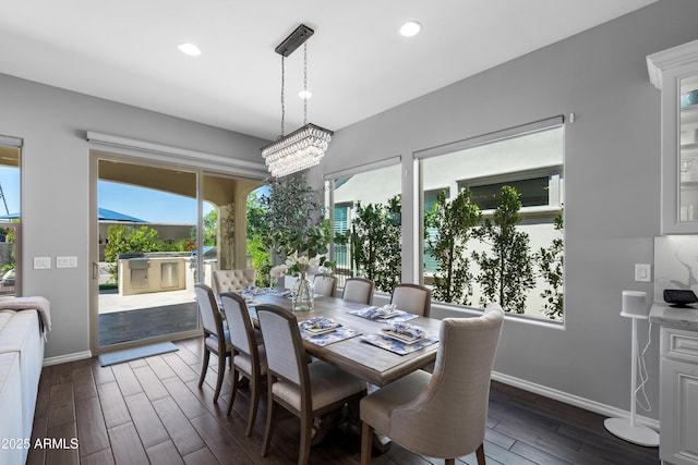 dining room with a notable chandelier, baseboards, recessed lighting, and dark wood-type flooring