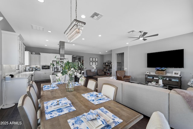 dining space featuring recessed lighting, dark wood finished floors, visible vents, and ceiling fan