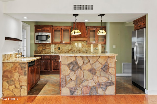 kitchen featuring decorative backsplash, appliances with stainless steel finishes, dark hardwood / wood-style flooring, sink, and decorative light fixtures