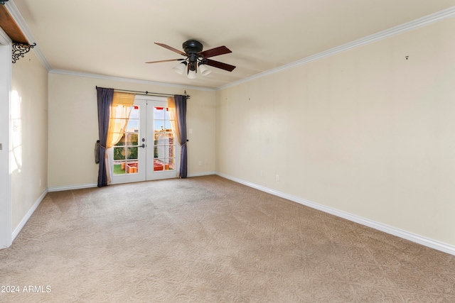 empty room with light carpet, french doors, ceiling fan, and crown molding