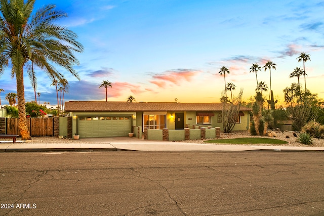 single story home featuring a garage