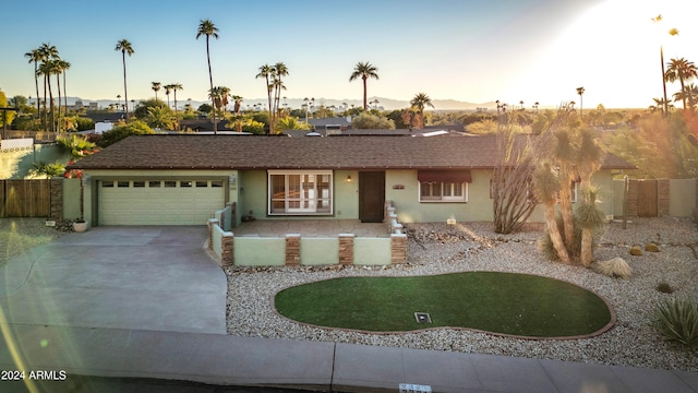 ranch-style home with a garage