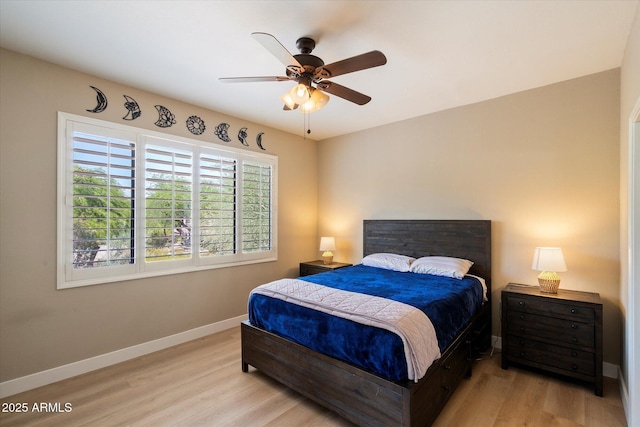 15151 N Frank Lloyd Wright Blvd Unit 2086, Scottsdale, AZ 85260 - bedroom with light wood-style floors and a ceiling fan
