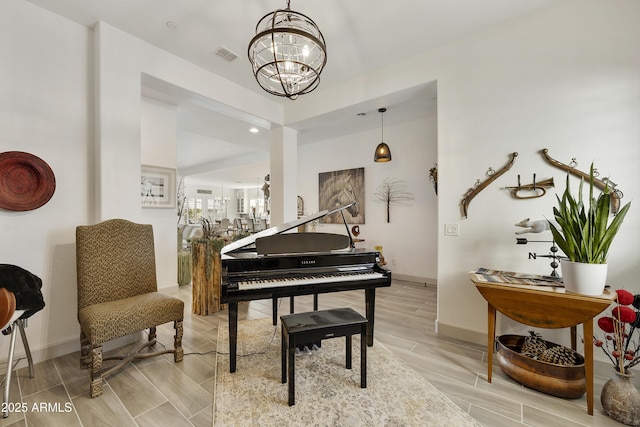 miscellaneous room with a notable chandelier