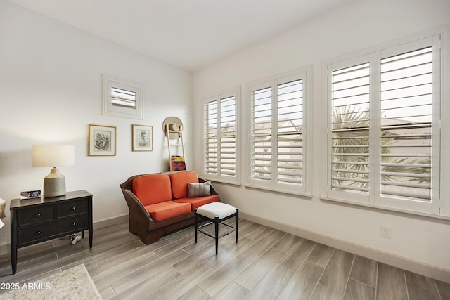 sitting room featuring light hardwood / wood-style flooring