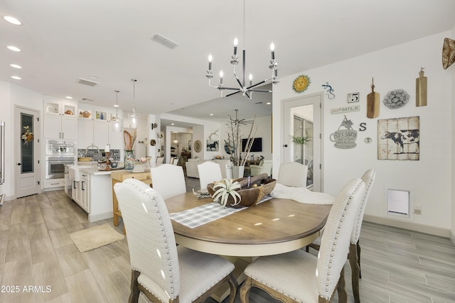 dining room with a notable chandelier