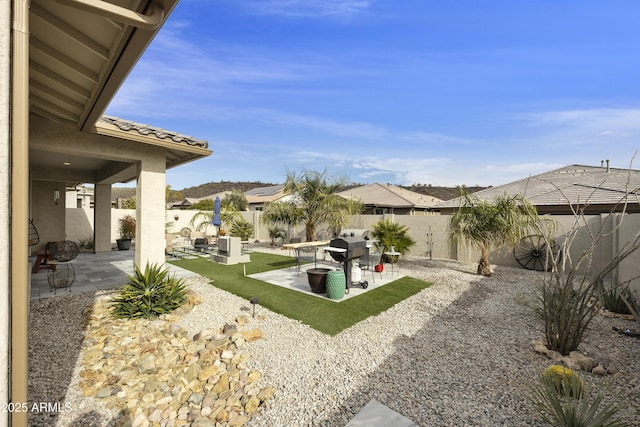 view of yard with an outdoor living space and a patio