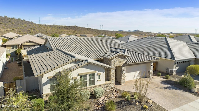 birds eye view of property featuring a mountain view