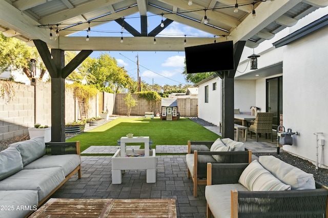 view of patio / terrace with a gazebo, a fenced backyard, and an outdoor living space