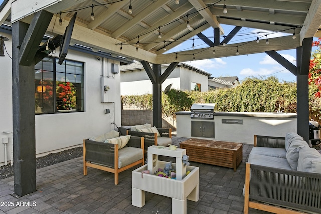 view of patio / terrace featuring area for grilling, an outdoor kitchen, and an outdoor hangout area