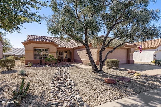 mediterranean / spanish-style home featuring a garage