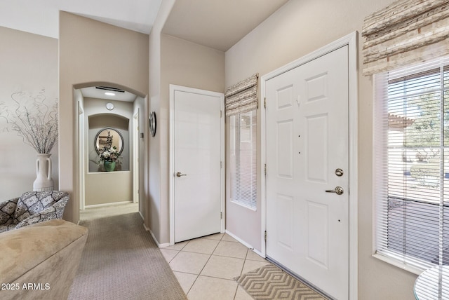 foyer with light tile patterned floors