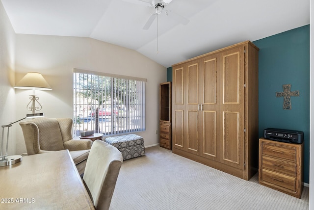 sitting room featuring lofted ceiling, ceiling fan, and light carpet