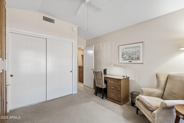 carpeted office space featuring ceiling fan and lofted ceiling