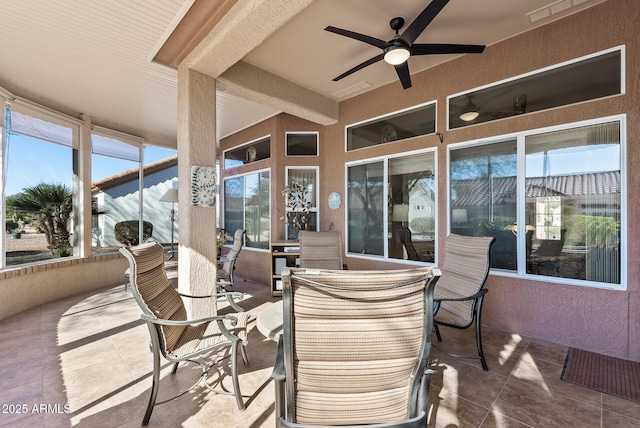 view of patio featuring ceiling fan