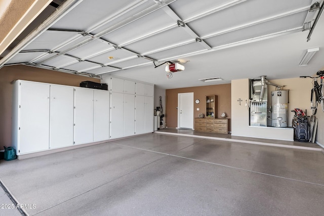 garage with a garage door opener and gas water heater