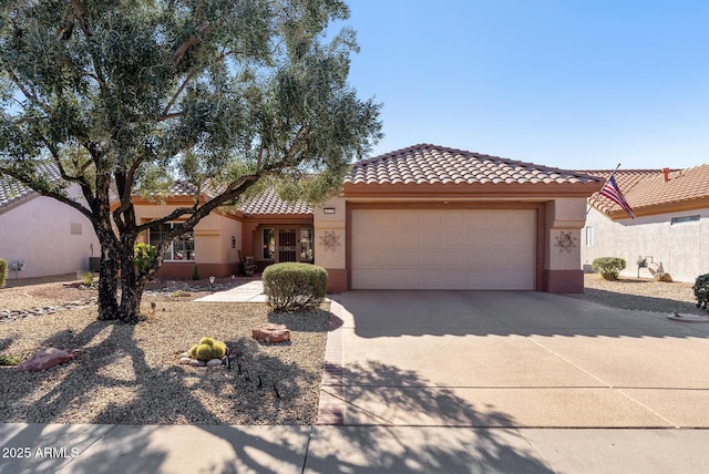 mediterranean / spanish-style house featuring a garage