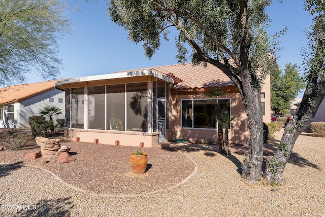 view of front of property with a sunroom