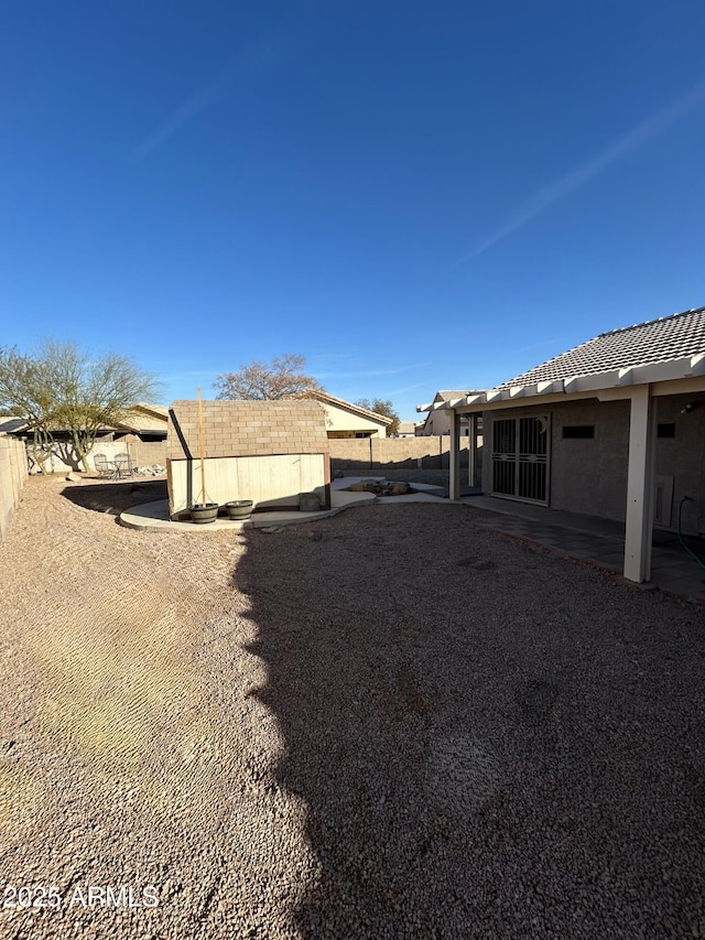 exterior space featuring a patio and fence