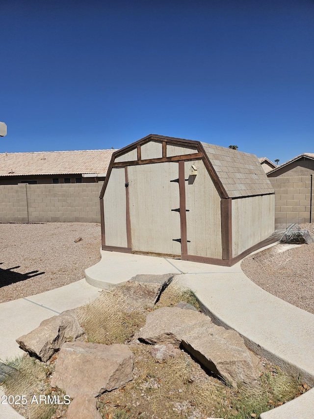 view of shed featuring a fenced backyard