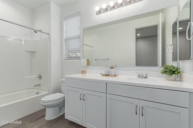 19873 W San Juan Ave, Litchfield Park, AZ 85340 - full bathroom featuring wood finished floors, toilet, bathtub / shower combination, and vanity