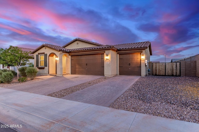 19873 W San Juan Ave, Litchfield Park, AZ 85340 - mediterranean / spanish home featuring stucco siding, driveway, and a tile roof