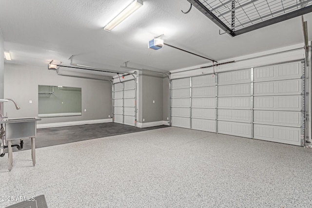 19873 W San Juan Ave, Litchfield Park, AZ 85340 - garage featuring baseboards and a garage door opener