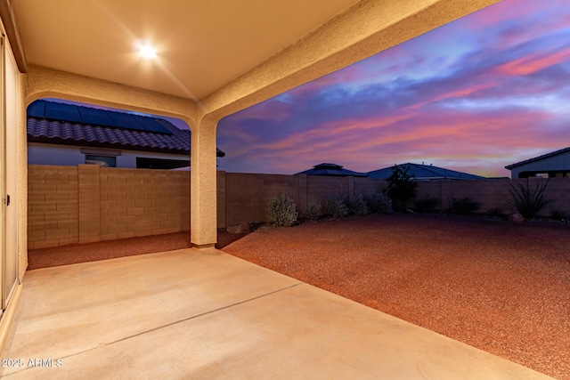 19873 W San Juan Ave, Litchfield Park, AZ 85340 - patio terrace at dusk featuring a fenced backyard